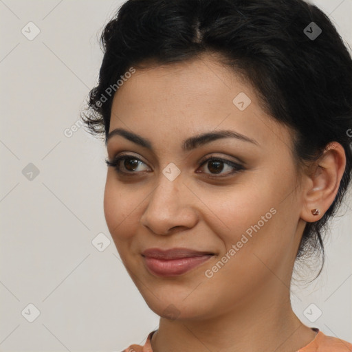 Joyful latino young-adult female with medium  brown hair and brown eyes