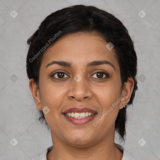 Joyful latino young-adult female with short  black hair and brown eyes