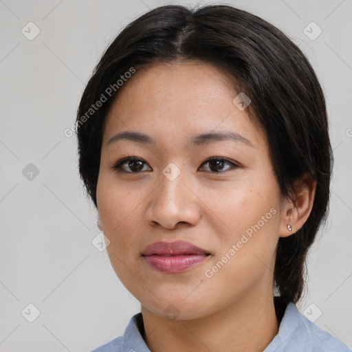 Joyful asian young-adult female with medium  brown hair and brown eyes