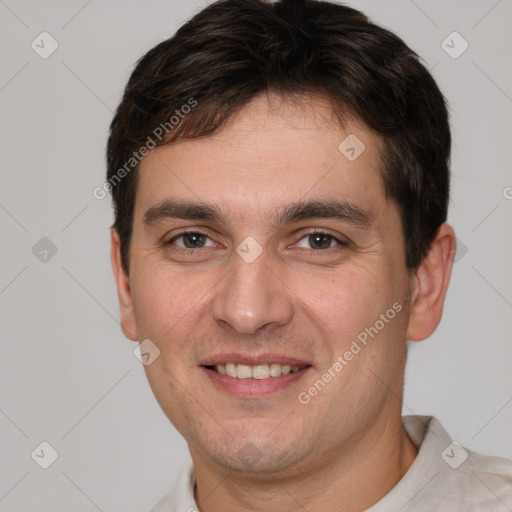 Joyful white young-adult male with short  brown hair and brown eyes