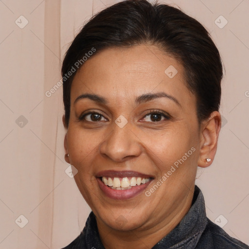 Joyful white adult female with long  brown hair and brown eyes