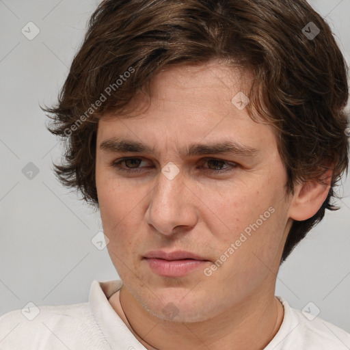 Joyful white adult male with medium  brown hair and brown eyes