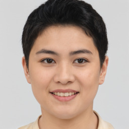 Joyful asian young-adult female with short  brown hair and brown eyes