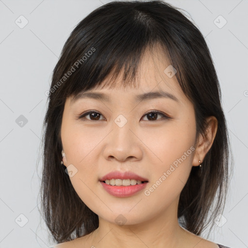 Joyful asian young-adult female with medium  brown hair and brown eyes