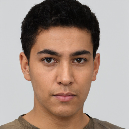 Neutral latino young-adult male with short  brown hair and brown eyes
