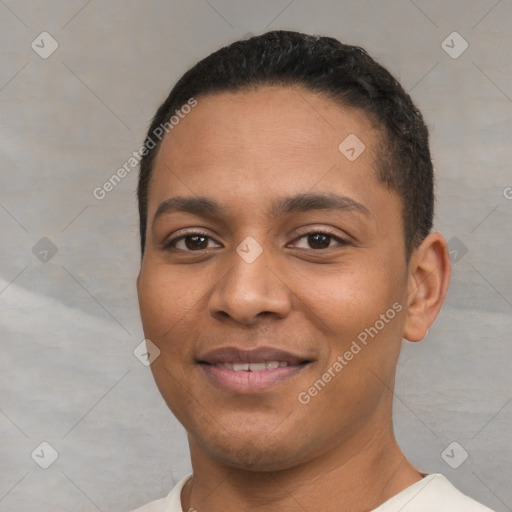 Joyful latino young-adult male with short  black hair and brown eyes