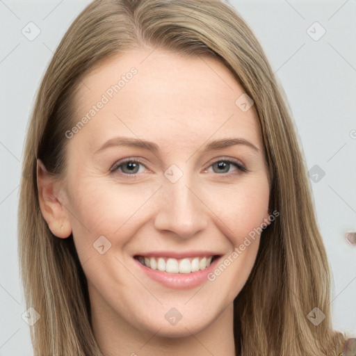 Joyful white young-adult female with long  brown hair and grey eyes