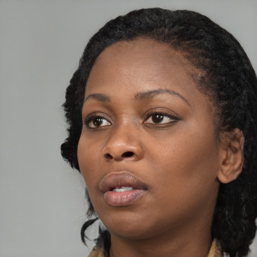 Neutral black young-adult female with long  black hair and brown eyes