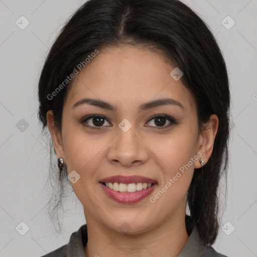 Joyful latino young-adult female with medium  brown hair and brown eyes