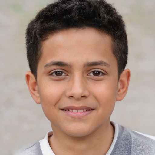 Joyful white child male with short  brown hair and brown eyes