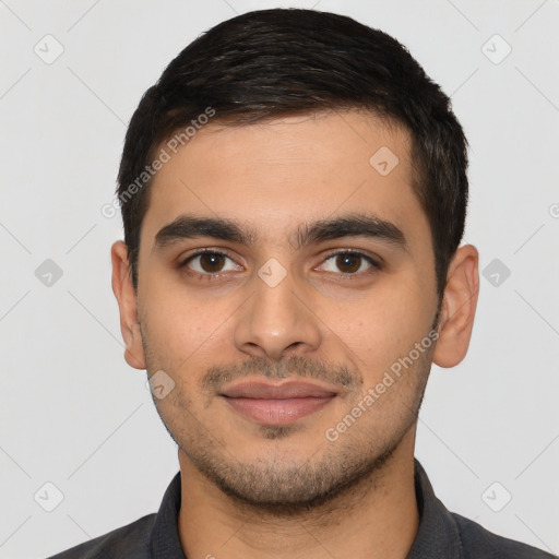 Joyful latino young-adult male with short  brown hair and brown eyes