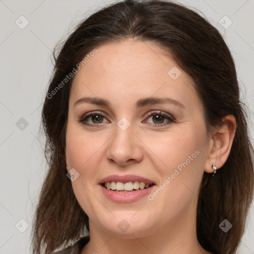 Joyful white young-adult female with long  brown hair and grey eyes