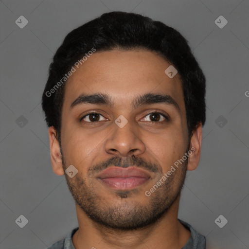 Joyful latino young-adult male with short  brown hair and brown eyes