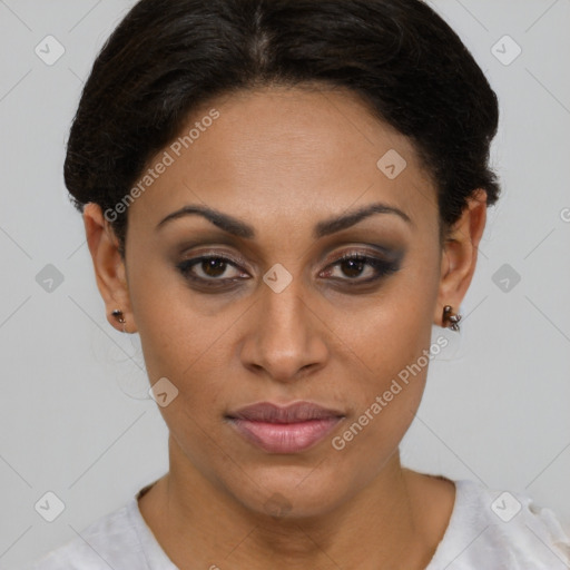 Joyful latino young-adult female with short  brown hair and brown eyes