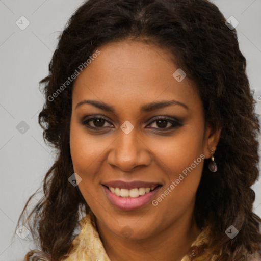 Joyful black young-adult female with long  brown hair and brown eyes