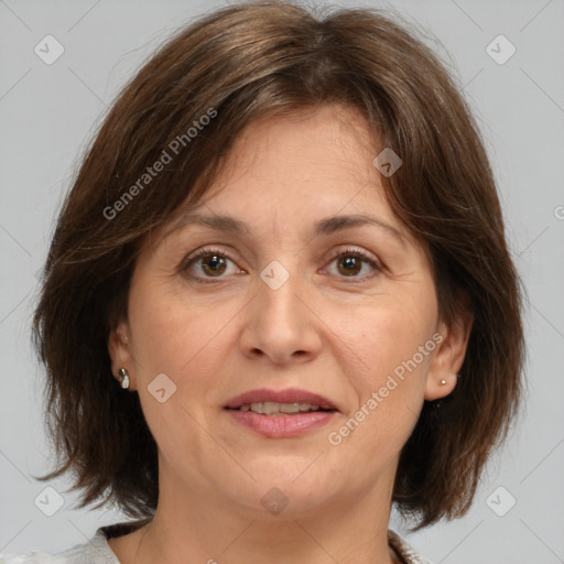 Joyful white adult female with medium  brown hair and brown eyes