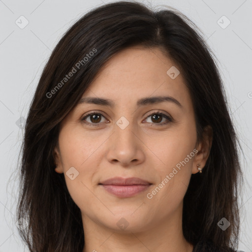 Joyful asian young-adult female with long  brown hair and brown eyes