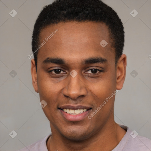 Joyful black young-adult male with short  black hair and brown eyes