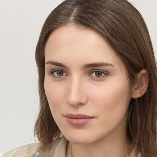 Neutral white young-adult female with long  brown hair and brown eyes