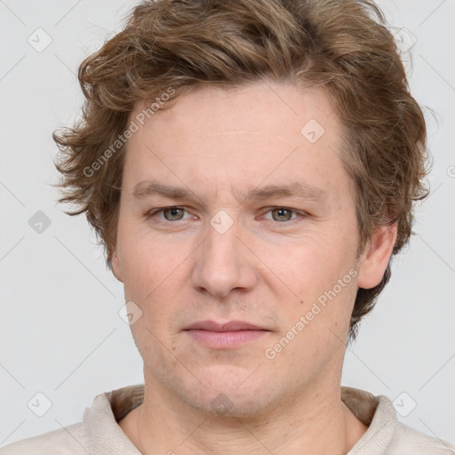 Joyful white adult male with short  brown hair and grey eyes