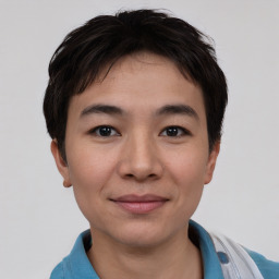 Joyful asian young-adult female with short  brown hair and brown eyes