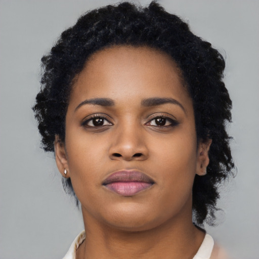 Neutral black young-adult female with long  black hair and brown eyes