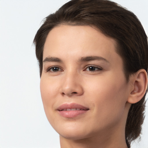 Joyful white young-adult female with medium  brown hair and brown eyes