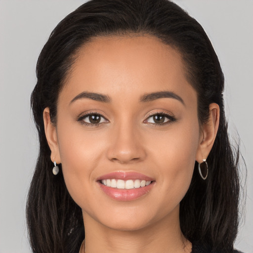 Joyful white young-adult female with long  brown hair and brown eyes