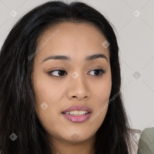 Joyful asian young-adult female with long  brown hair and brown eyes