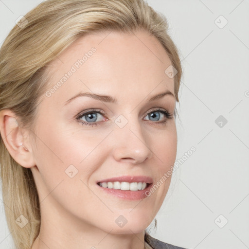 Joyful white young-adult female with long  brown hair and blue eyes