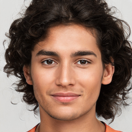 Joyful white young-adult male with medium  brown hair and brown eyes