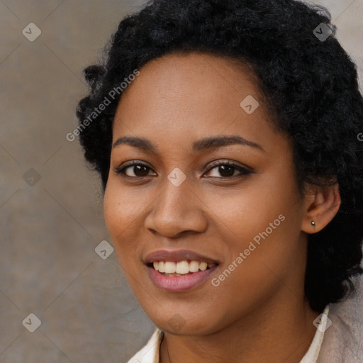 Joyful black young-adult female with long  black hair and brown eyes