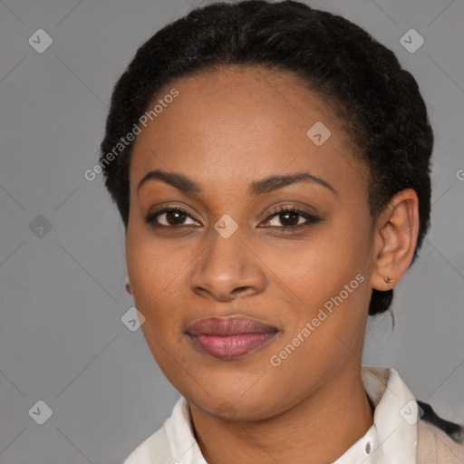 Joyful black young-adult female with short  black hair and brown eyes