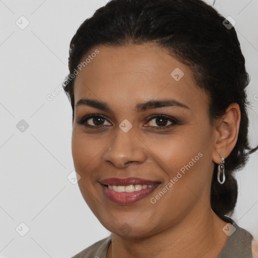 Joyful latino young-adult female with medium  black hair and brown eyes