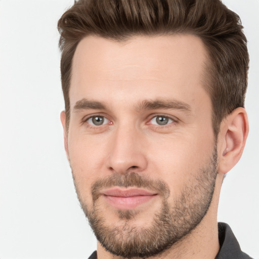 Joyful white young-adult male with short  brown hair and brown eyes