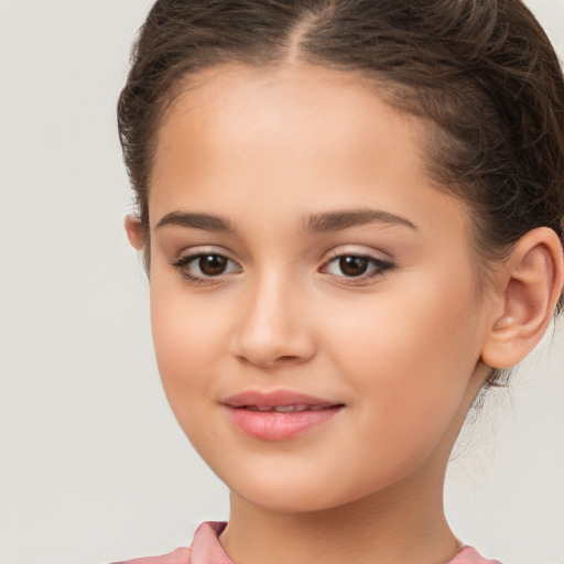 Joyful white child female with long  brown hair and brown eyes