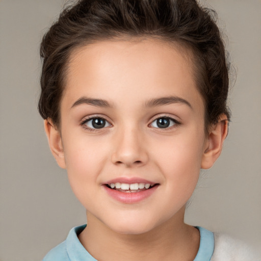 Joyful white child female with short  brown hair and brown eyes