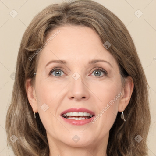 Joyful white adult female with medium  brown hair and grey eyes