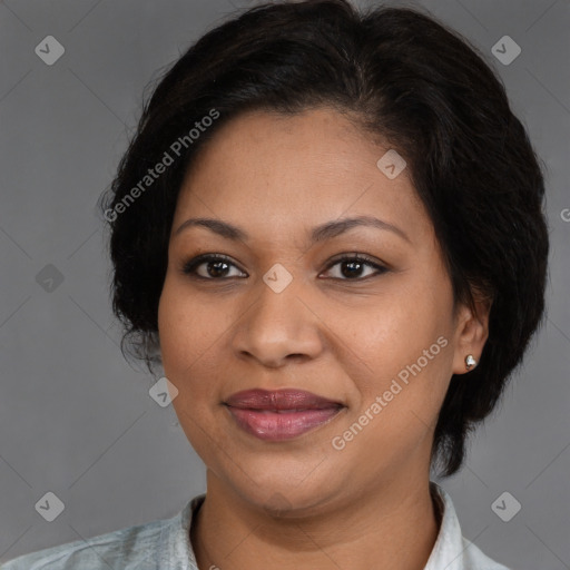 Joyful latino adult female with medium  brown hair and brown eyes