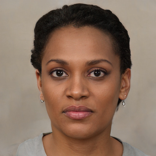 Neutral black young-adult female with short  black hair and brown eyes