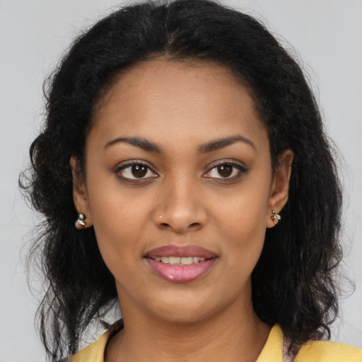 Joyful latino young-adult female with long  brown hair and brown eyes