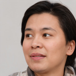 Joyful asian young-adult male with medium  brown hair and brown eyes