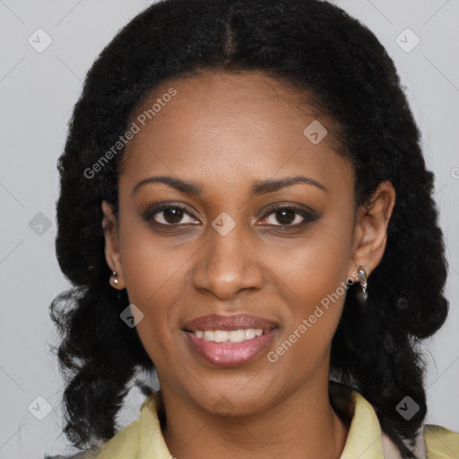 Joyful black young-adult female with long  black hair and brown eyes