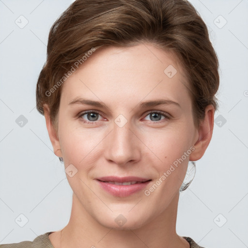 Joyful white young-adult female with short  brown hair and grey eyes