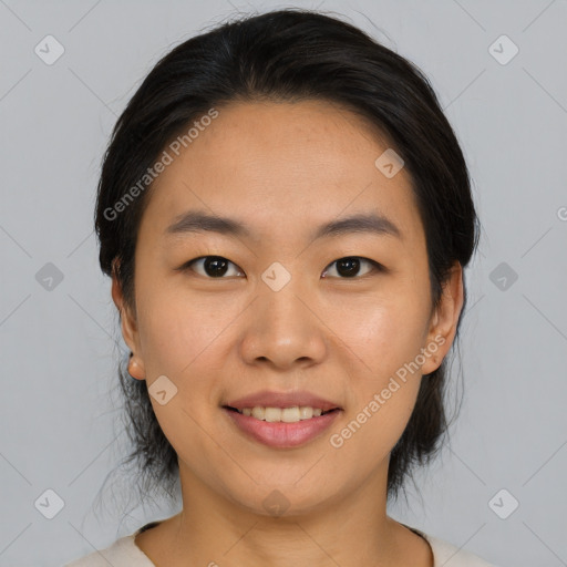 Joyful asian young-adult female with medium  brown hair and brown eyes