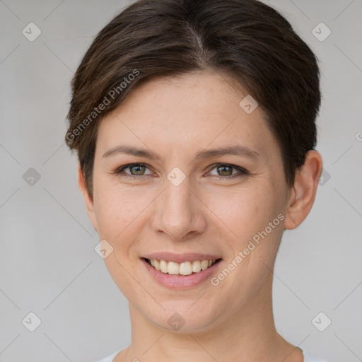 Joyful white young-adult female with short  brown hair and grey eyes