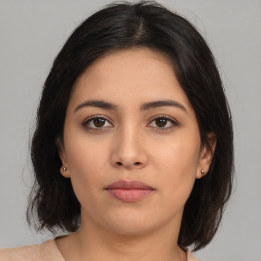 Neutral latino young-adult female with medium  brown hair and brown eyes