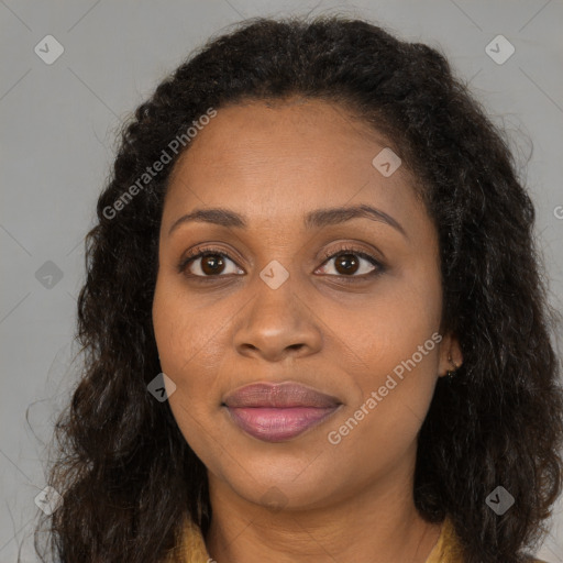 Joyful black young-adult female with long  brown hair and brown eyes