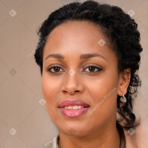 Joyful black young-adult female with long  brown hair and brown eyes