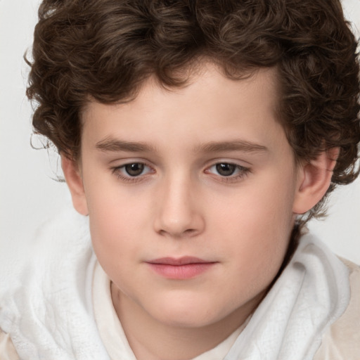 Joyful white child male with short  brown hair and brown eyes